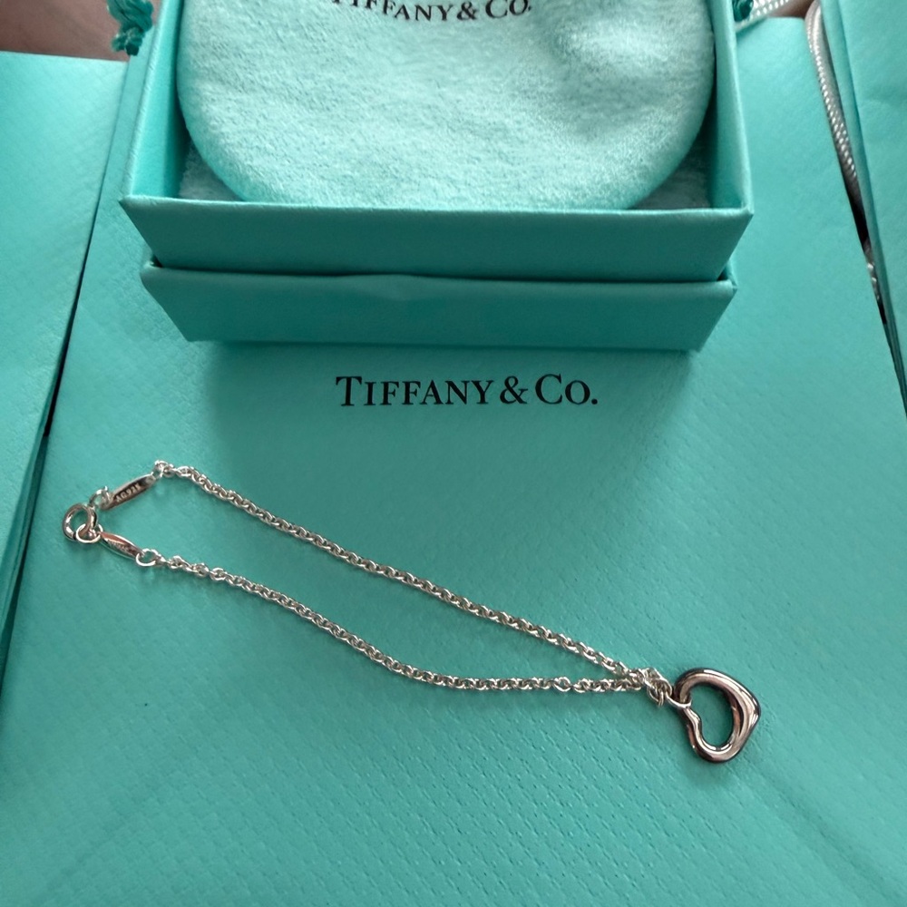 Tiffany & Co. Silver Open Heart Necklace on Blue